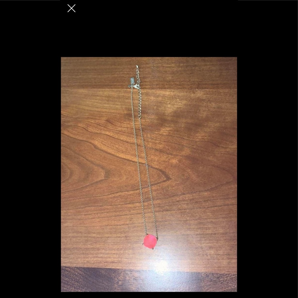 Kate Spade necklace with pink detail.